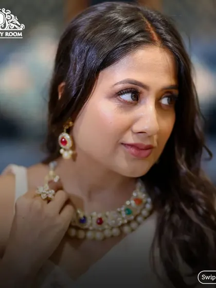 A side view showing the subtle makeup that enhances her features beautifully.