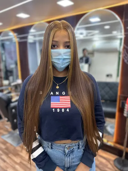 A front view of the global color and highlights, showing how it brightens up the client's whole look.