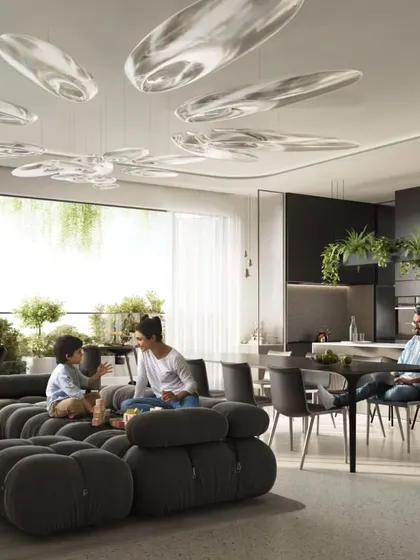 The living room of a Sky Gardens apartment, featuring modern furniture and a direct view of the lush balcony and the neighboring green tower.