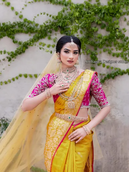 The complete look, with the sheer yellow veil adding a layer of elegance.