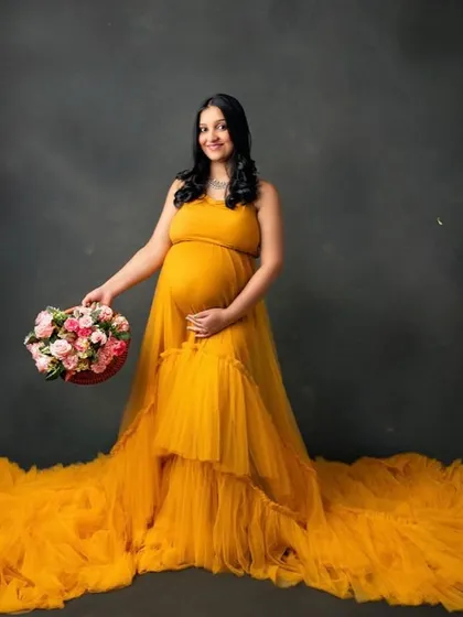 A sunny and cheerful portrait. The vibrant yellow gown brings so much warmth and happiness to the frame.