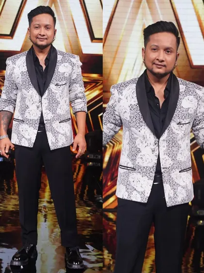 Singer Pawandeep Rajan strikes a pose in our white and black printed tuxedo jacket, a bold choice for a grand finale performance.