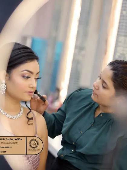 Another shot of the makeup application process, seen through a ring light. I take great care in ensuring every detail is perfect for your special occasion.