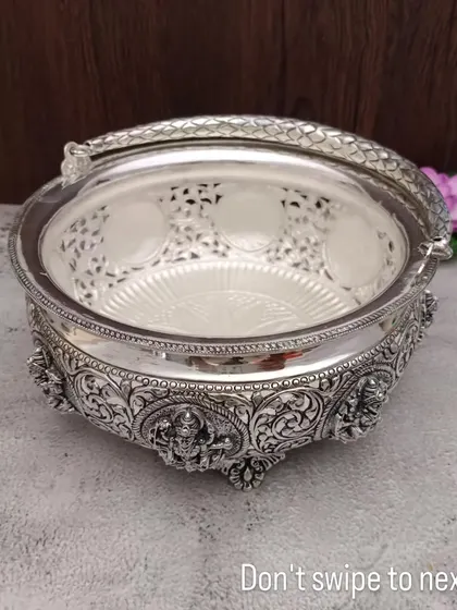 An antique German silver basket with an Ashtalakshmi design. This can be filled with sweets or other small items to create a beautiful gift.
