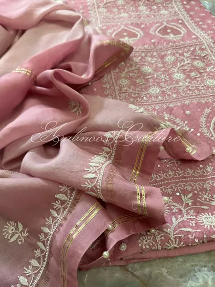 A detail shot of the dupatta's border, featuring gota, sequins, and seed pearls.