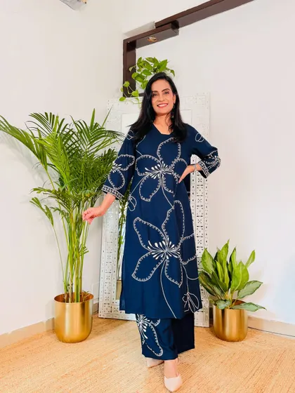 A comfortable and stylish navy blue kurta pant set. The white floral outline print is modern and chic, perfect for a casual work day.