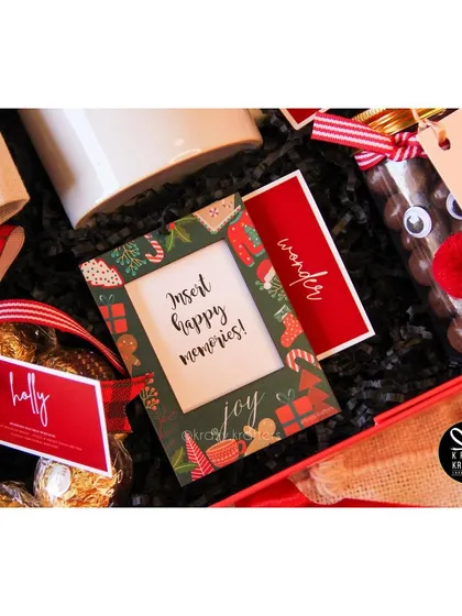 A Christmas-themed photo frame to 'insert happy memories', included in our holiday hampers.