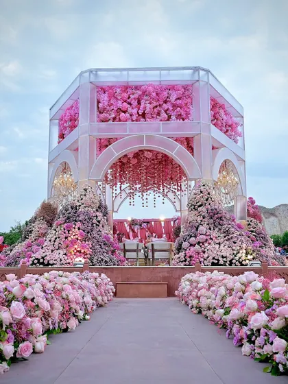 The sheer scale of this pink floral mandap is breathtaking. I designed it to be an immersive experience, with blooms covering every surface, creating a true floral paradise for the wedding ceremony.