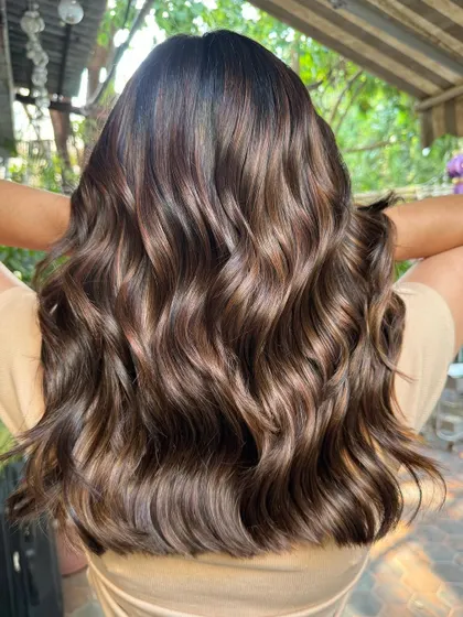 The back view of these golden caramel highlights. The color is so rich and the hair is so healthy. (No filter)
