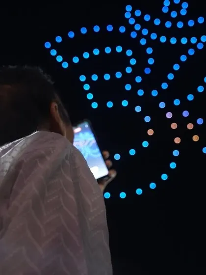 The sacred 'Om' symbol mesmerizes the audience at the Chintpurni Festival. Our shows create a deep spiritual connection, blending technology with faith.