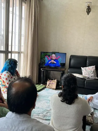 Gurubhais gathered in a home, watching a talk by Swami Kriyananda together. We find many ways to connect with the teachings and with each other, whether in person or through technology.