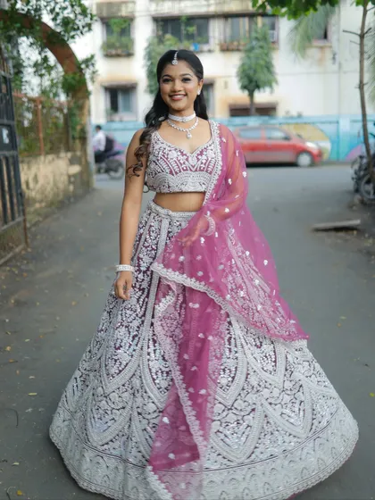 This full-length shot captures the joy and elegance of wearing a beautiful outfit for a special occasion.