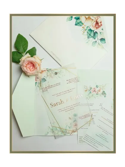 This suite captures a soft and gentle elegance with its watercolor florals and earthy pastel tones. The main invitation is a uniquely shaped tag made of vellum, adding a modern touch.