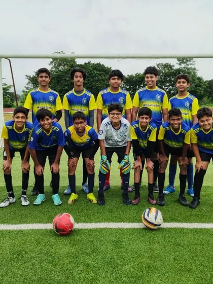 Our U15 residential team poses for a group photo on the pitch before a practice match. This picture captures the unity and readiness of the squad, ready to compete as one.