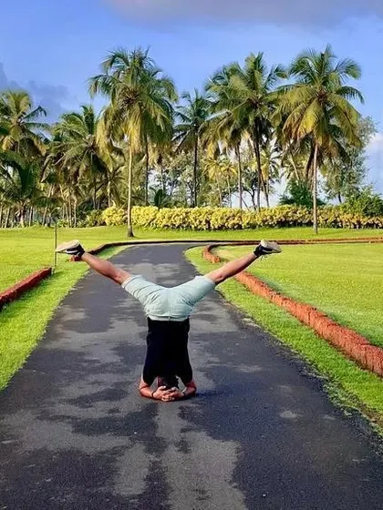 Yoga is a science of well-being. These images capture the beauty of practicing in nature, from the beach at sunrise to a lush green park, reminding us to connect with the world around us.