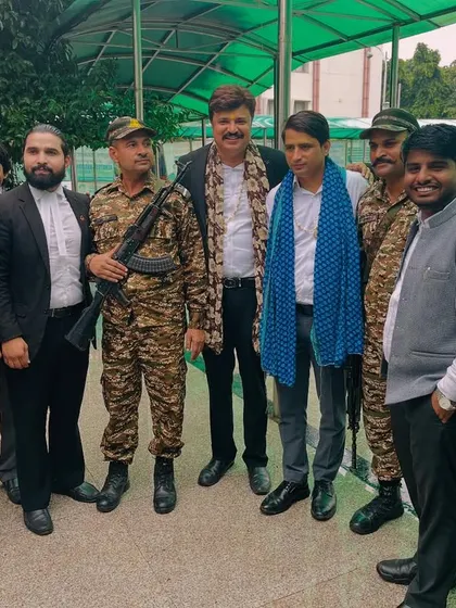 With fellow lawyers and security personnel at a court event. We work in a challenging environment and value the support of everyone involved.