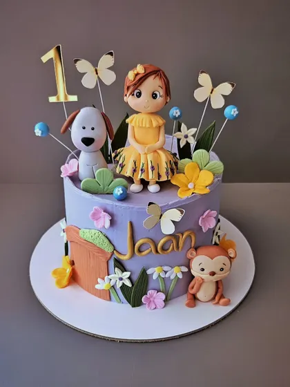 A pretty lavender cake for Jaan's first birthday, decorated with her favorite animal friends and beautiful butterflies.