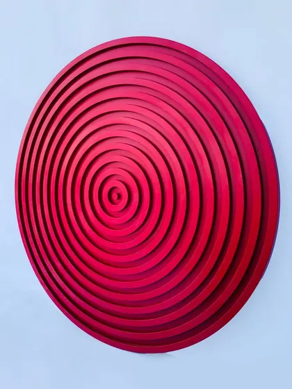 This view emphasizes the three-dimensional quality of the concentric circles, which makes it a standout piece of modern wall decor.