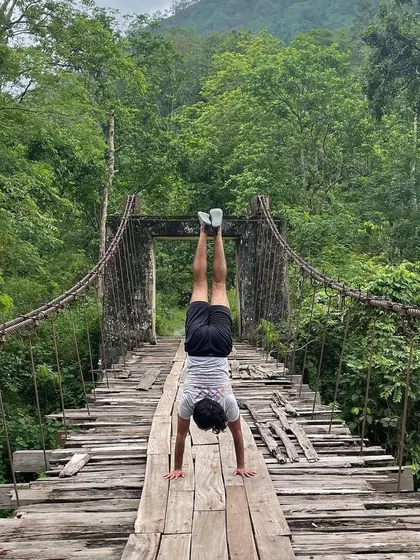 Handstand on a rickety bridge over the River Rangeet between West Bengal and Sikkim. It's all about finding stability in unstable environments.