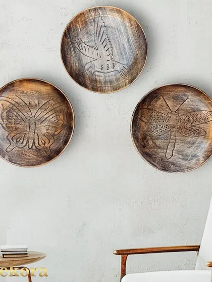 This set of three creative wall decor plates is a simple way to create an artistic focal point.