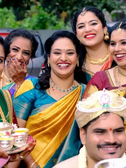 The joy of being surrounded by loved ones. This candid shot captures the happy faces of family members as they celebrate with the groom.