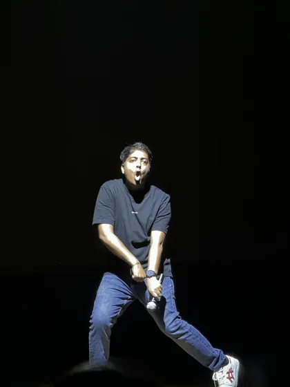 Aakash Gupta's high-energy performance style captured in a single, expressive shot.
