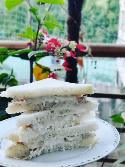 A classic Chicken Mayo Sandwich, perfect for high-tea events or as a light party snack. We also offer simple and fresh green chutney sandwiches.