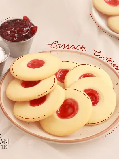 Our Cassack Cookies are a type of thumbprint cookie, with a buttery shortbread base and a sweet jam filling.
