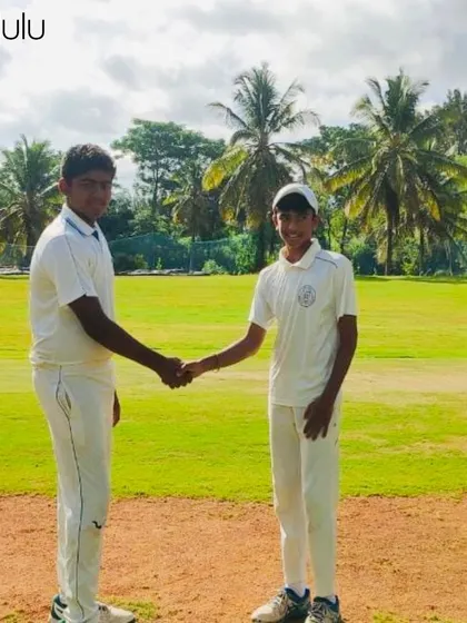 A handshake on the cricket pitch, a classic sign of sportsmanship. We teach our players the importance of respecting the game and their opponents.