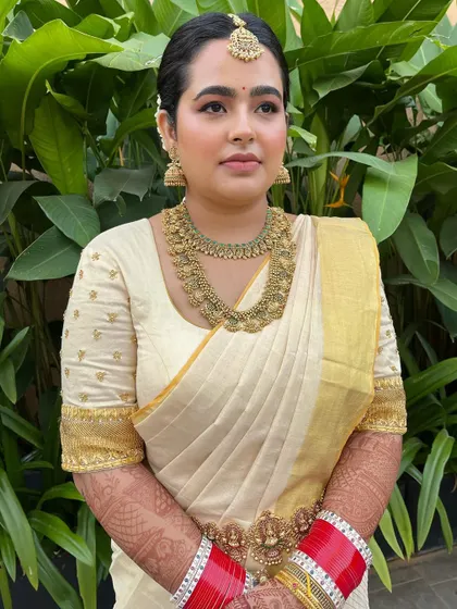 Another beautiful portrait showcasing the traditional jewelry and the flawless, glowing skin. The look is simple yet stunning.