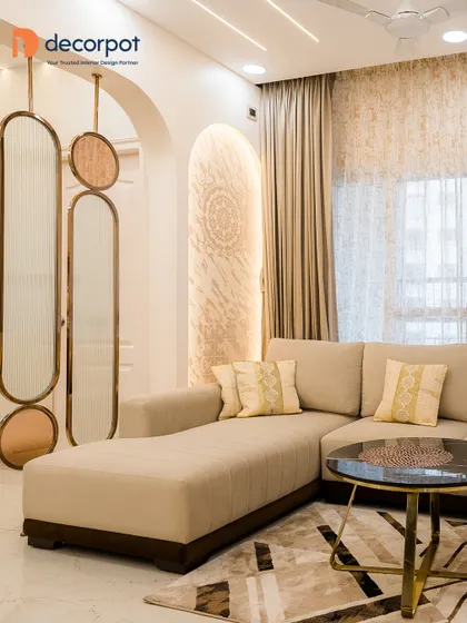 We created a luxurious and inviting living room with a comfortable beige sectional, elegant hanging partitions, and soft, ambient lighting. The design focuses on creating a sophisticated yet relaxed atmosphere.
