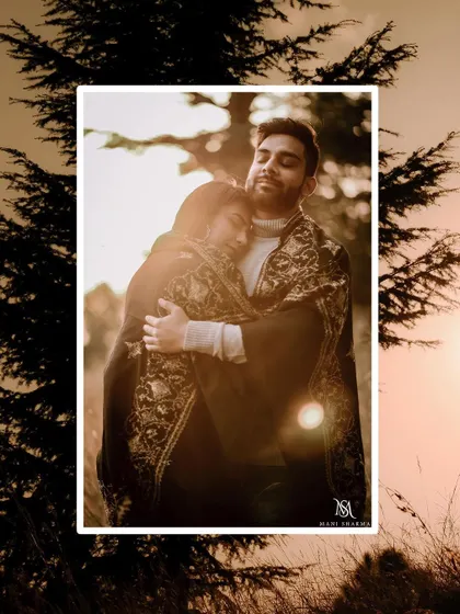 A warm, sun-flared shot that feels incredibly romantic and intimate, perfect for a mountain pre-wedding story.