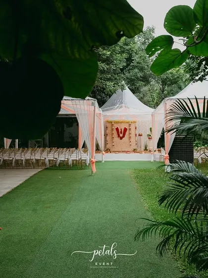 The Nalugu ceremony takes place in a beautiful outdoor setting, with the decor enhancing the natural beauty of the surroundings.