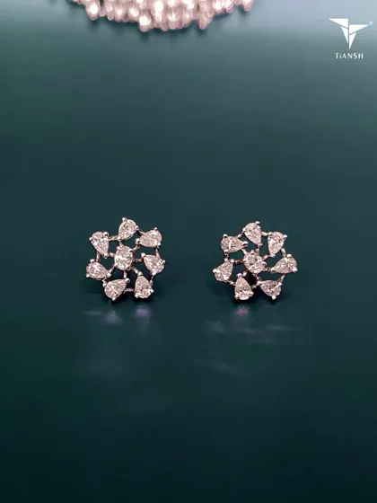 A subtle yet stunning statement piece for the festive season. These pear shaped diamond floral studs are versatile and will complement any style.