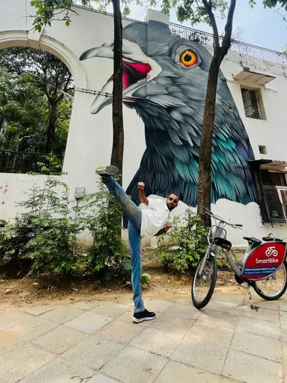 Martial arts is about finding strength and balance everywhere. Here I am practicing a high kick at the Lodhi Art District, blending the discipline of Taekwon-Do with the energy of Delhi.