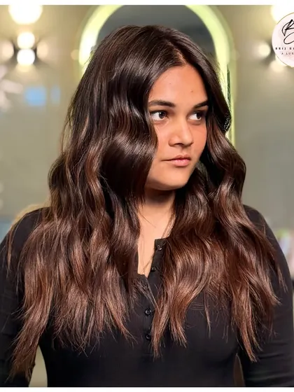 Another angle of this magical brown hair color. The light catches the subtle dimensions, creating a look that is both natural and glamorous.
