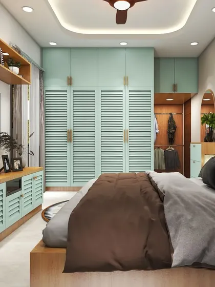 A view of the bed and the full wall of wardrobes. The open-shelf section in the wardrobe adds a practical touch for frequently used items or display pieces.