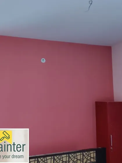 A room with a dusty rose accent wall, a sophisticated and modern shade of pink.