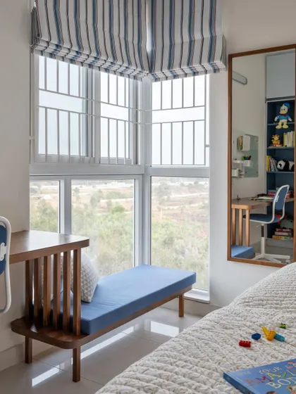 We incorporated a window seat alongside the study in this kids' room, creating a versatile space for play, reading, or simply enjoying the view.