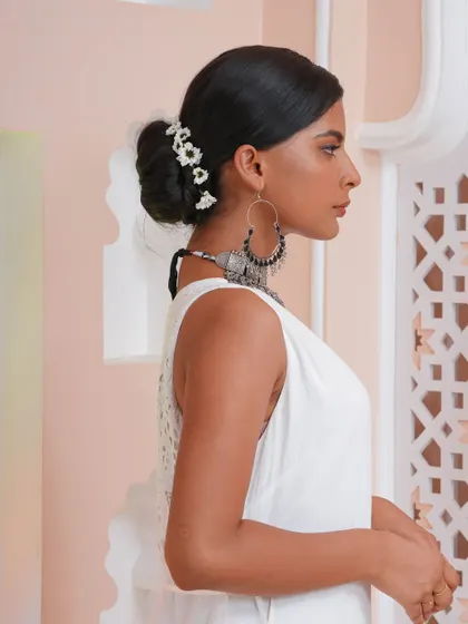 A classic, elegant bun created with the help of our hair extensions. Adding extensions provides the necessary volume and length for intricate updos, perfect for weddings and formal events.