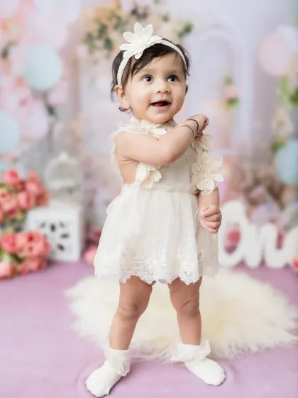 Another proud standing moment from this little girl's first birthday studio session.