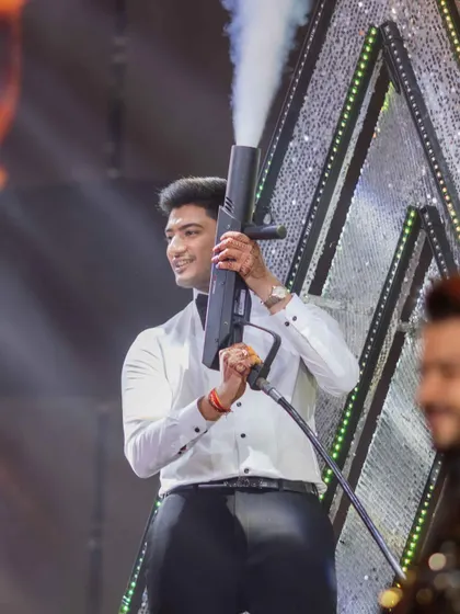 We love incorporating fun props like this CO2 gun to add extra drama and excitement to a groom's performance. It's all about creating a show.