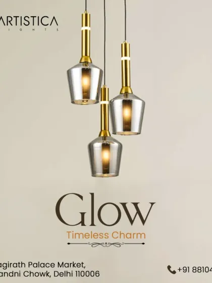 A beautiful cluster of three bell-shaped pendants with smoked glass and gold accents. This arrangement provides a timeless charm and a warm, layered light effect, perfect for hanging over a small table or in an entryway.