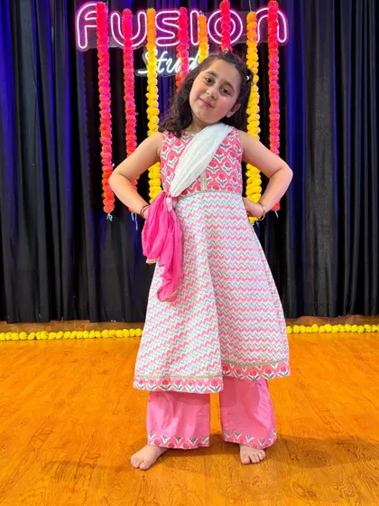 Our little performers dressed up and ready for their end-of-batch video shoot. We love seeing their confidence shine through.