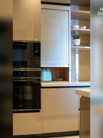 A close-up of the built-in oven and microwave tower, demonstrating how we seamlessly integrate modern appliances into our custom cabinetry for a clean, streamlined look.