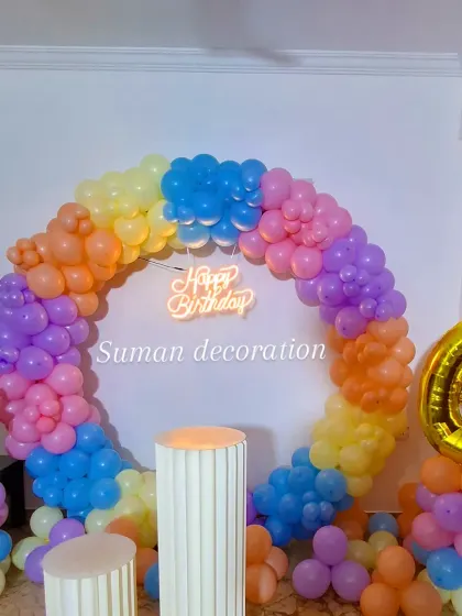 A straight-on view of the rainbow unicorn balloon ring, showing the bright color combination and the unicorn head balloon accent.