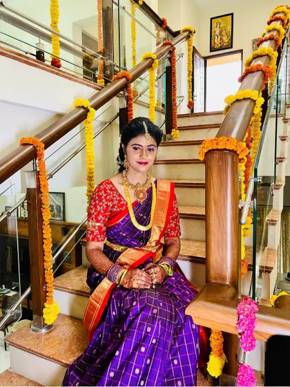The bride looks so serene and beautiful in this shot. The makeup is soft and enhances her features, perfect for the occasion.