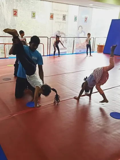 A Friday evening class with our "Good Friends" group. The images show a variety of activities, from warm-up exercises to practicing cartwheels with instructor support.