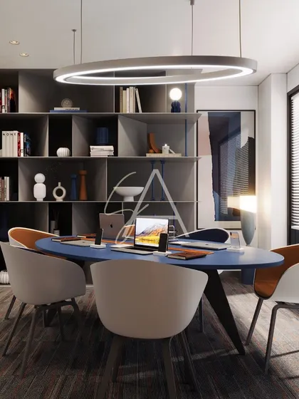 This view shows the functional storage integrated into the meeting room design. The open shelving provides space for books and decor, adding a personal touch to the professional setting.