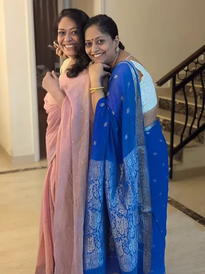 Sharing a happy moment with my sister during Diwali. We are both wearing sarees that reflect our individual styles, showing how versatile this beautiful garment can be.